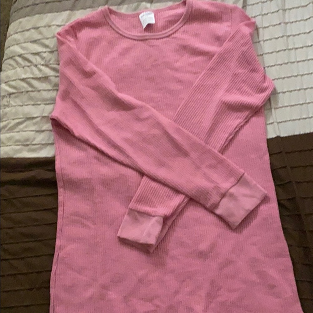A pink long sleeved shirt